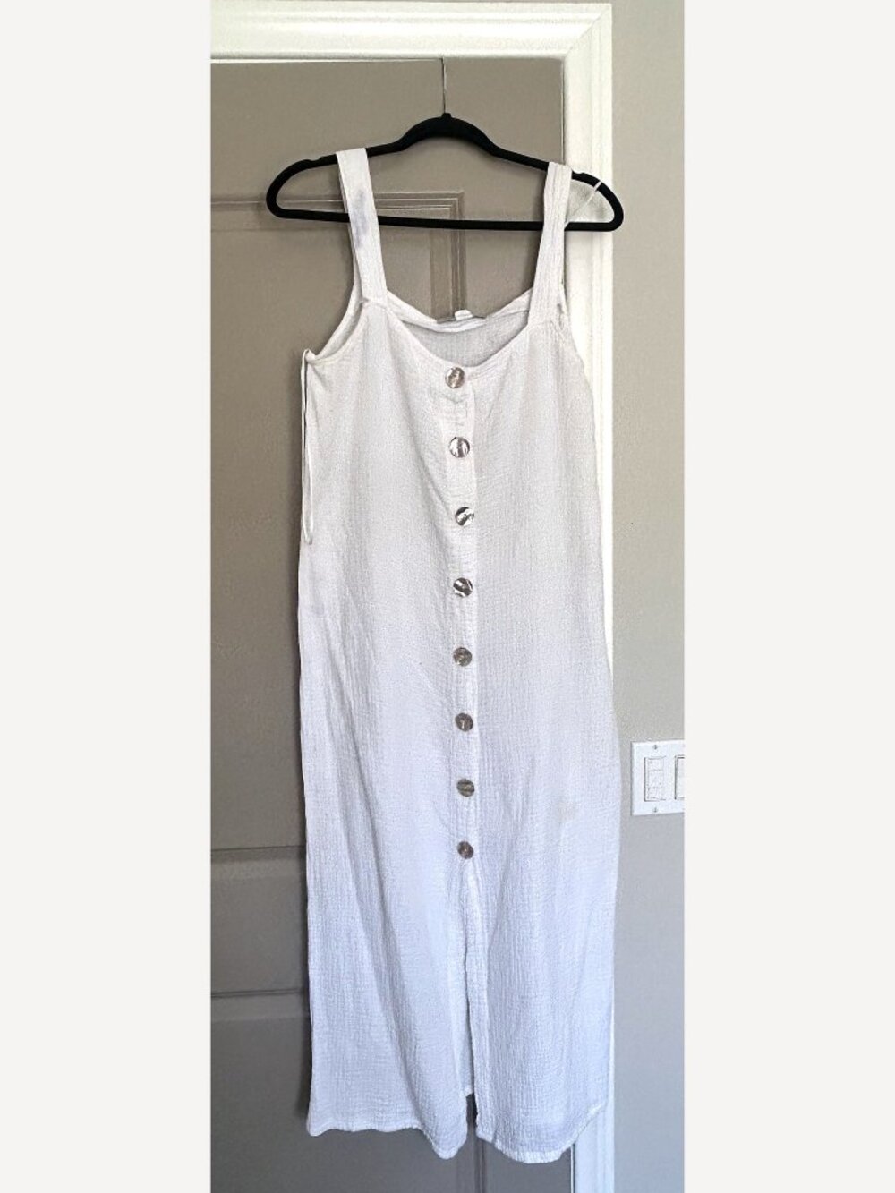 Maurie + Eve white midi dress in a soft, textured gauze.